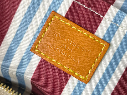 Intricately patterned coated canvas bag